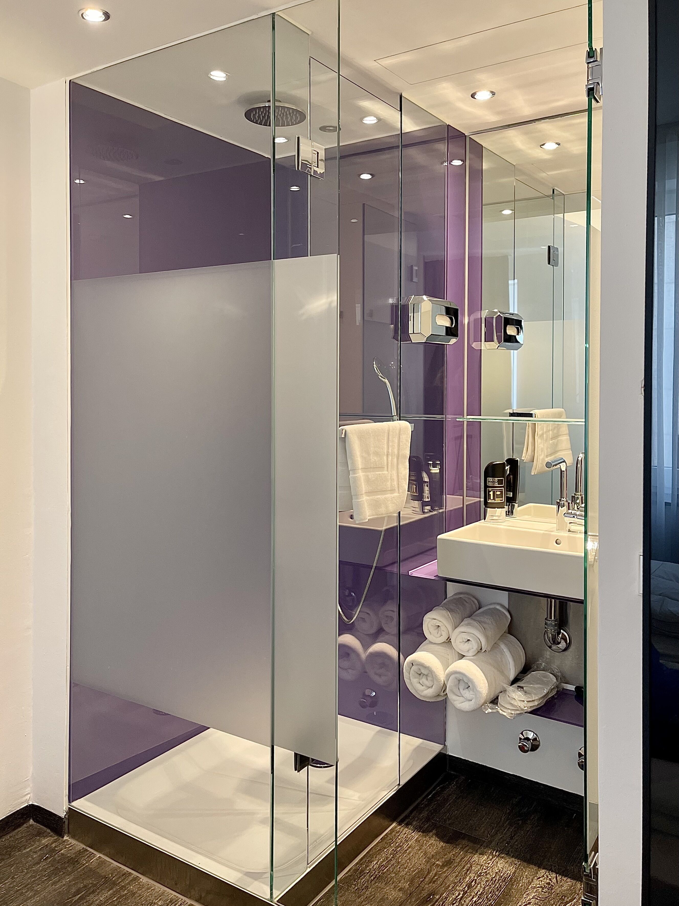 standard double room | bathroom | shower, rainfall showerhead, hair dryer, slippers