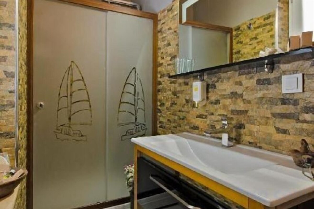 Shower, rainfall showerhead, designer toiletries, hair dryer