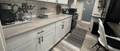 Microwave, coffee/tea maker, cookware/dishes/utensils