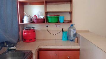 Fridge, electric kettle, cookware/dishes/utensils