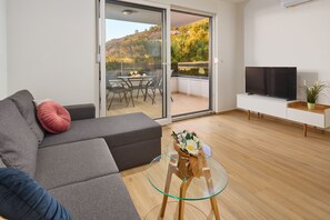 Apartment, 2 Bedrooms, Terrace, Ground Floor | Living area | 91-cm TV with cable channels - Sun Spalato Residence (Makarska)