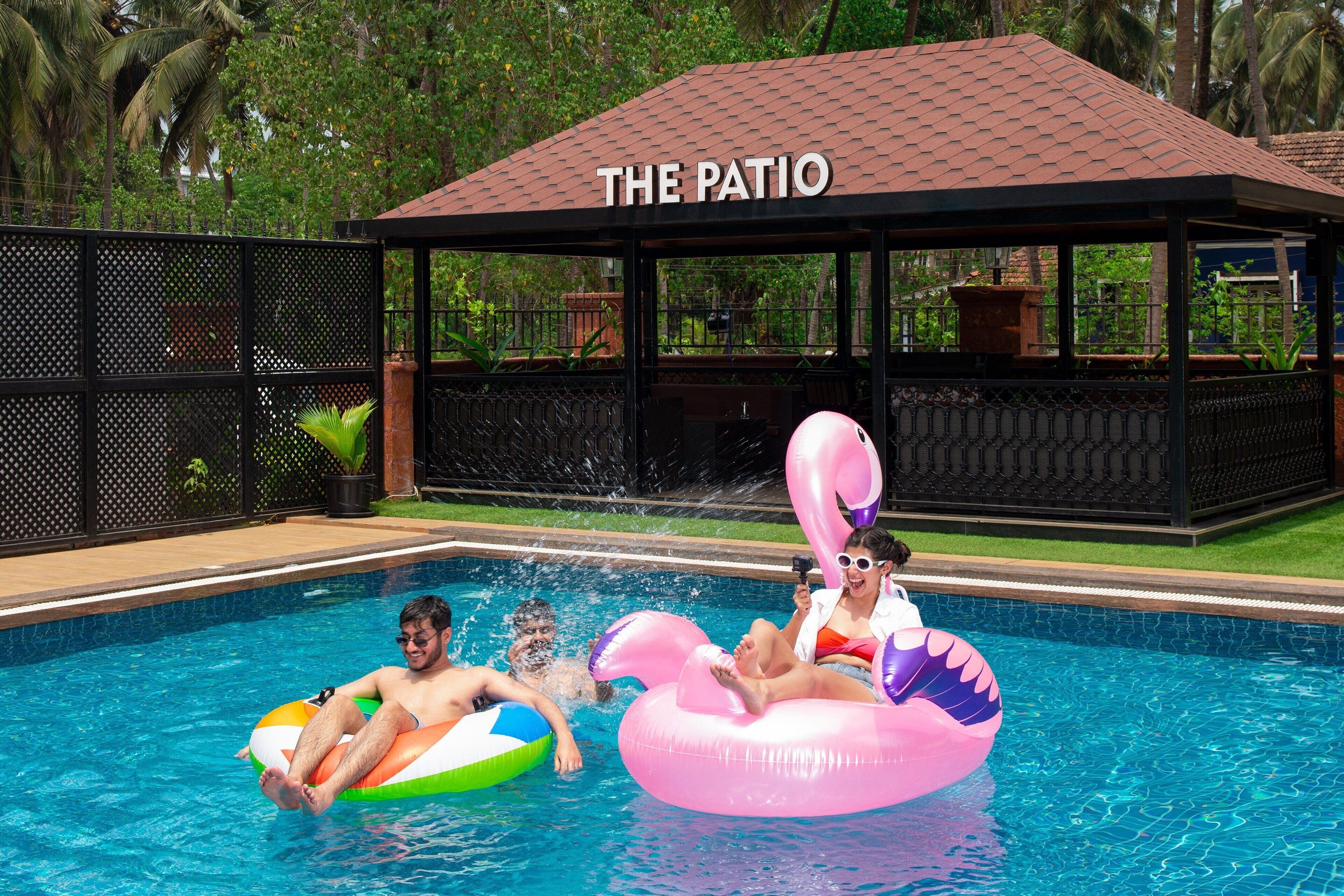 A swimming pool area with a covered seating area labeled "THE PATIO."