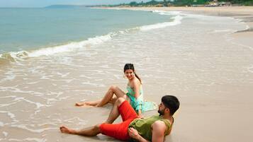 Guests can enjoy a serene beach experience with ocean views.