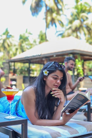 Outdoor pool, open 7:00 AM to 9:00 PM, pool loungers, lifeguards on site. Fairfield by Marriott Goa Calangute