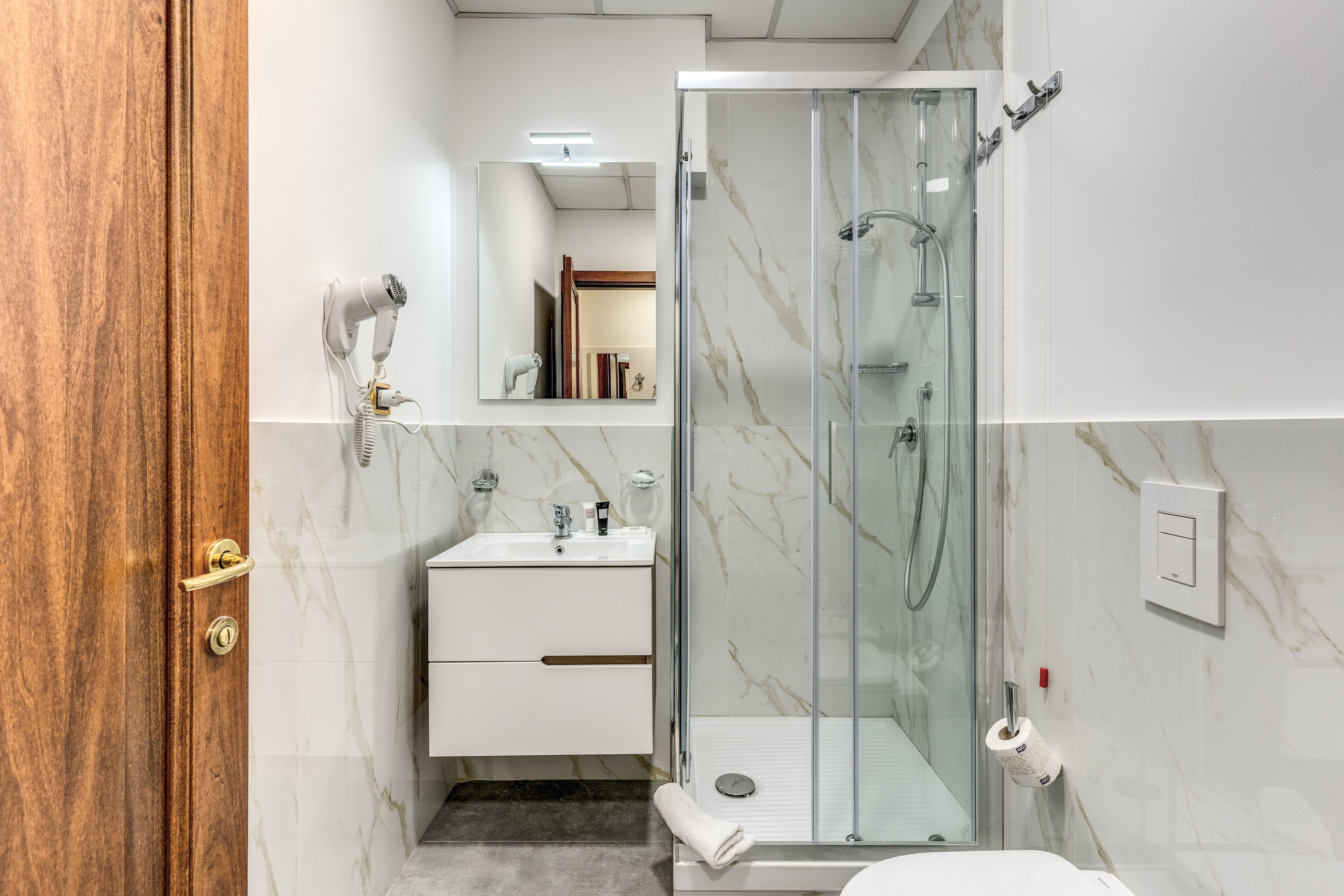 shower, designer toiletries, hair dryer, soap