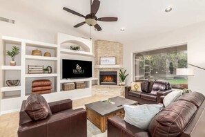 TV, fireplace, books