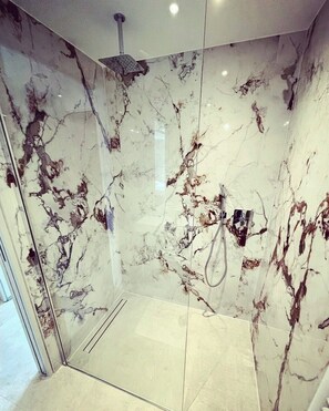 Bathtub, hair dryer, towels, soap