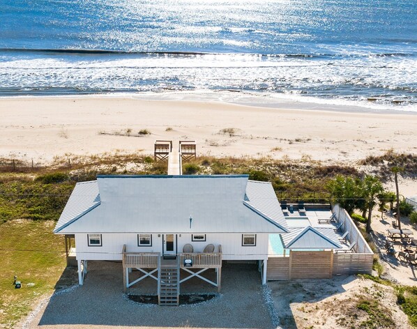 A beach house with a covered patio, a small pool, and a beach view. - Sugar Magnolia: Beachfront SGI Home- Sleeps 12, Priv. Pool, Pet Friendly! (St. George Island)