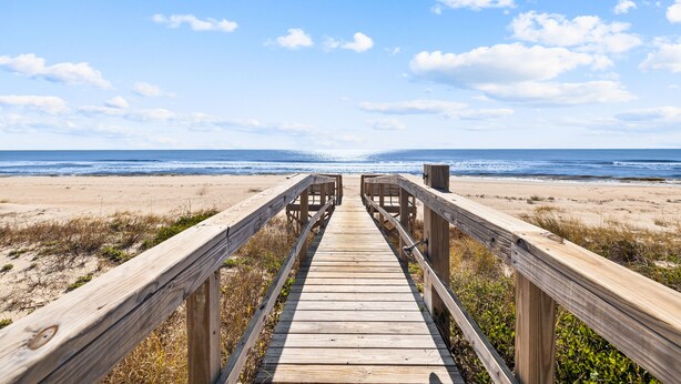 A wooden boardwalk leading to a beach with a clear sky. - Sugar Magnolia: Beachfront SGI Home- Sleeps 12, Priv. Pool, Pet Friendly! (St. George Island)