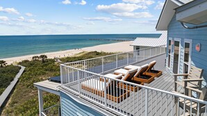 A balcony with a view of the beach and ocean. - Seven Seas: Book your stay and enjoy the Island's first Splash Pad! (St. George Island)