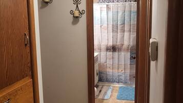 Combined shower/tub, hair dryer, towels, soap