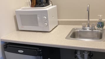 Fridge, microwave, coffee/tea maker, dining tables