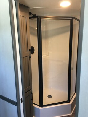 Shower, towels, soap, toilet paper