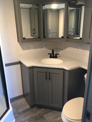 Shower, towels, soap, toilet paper