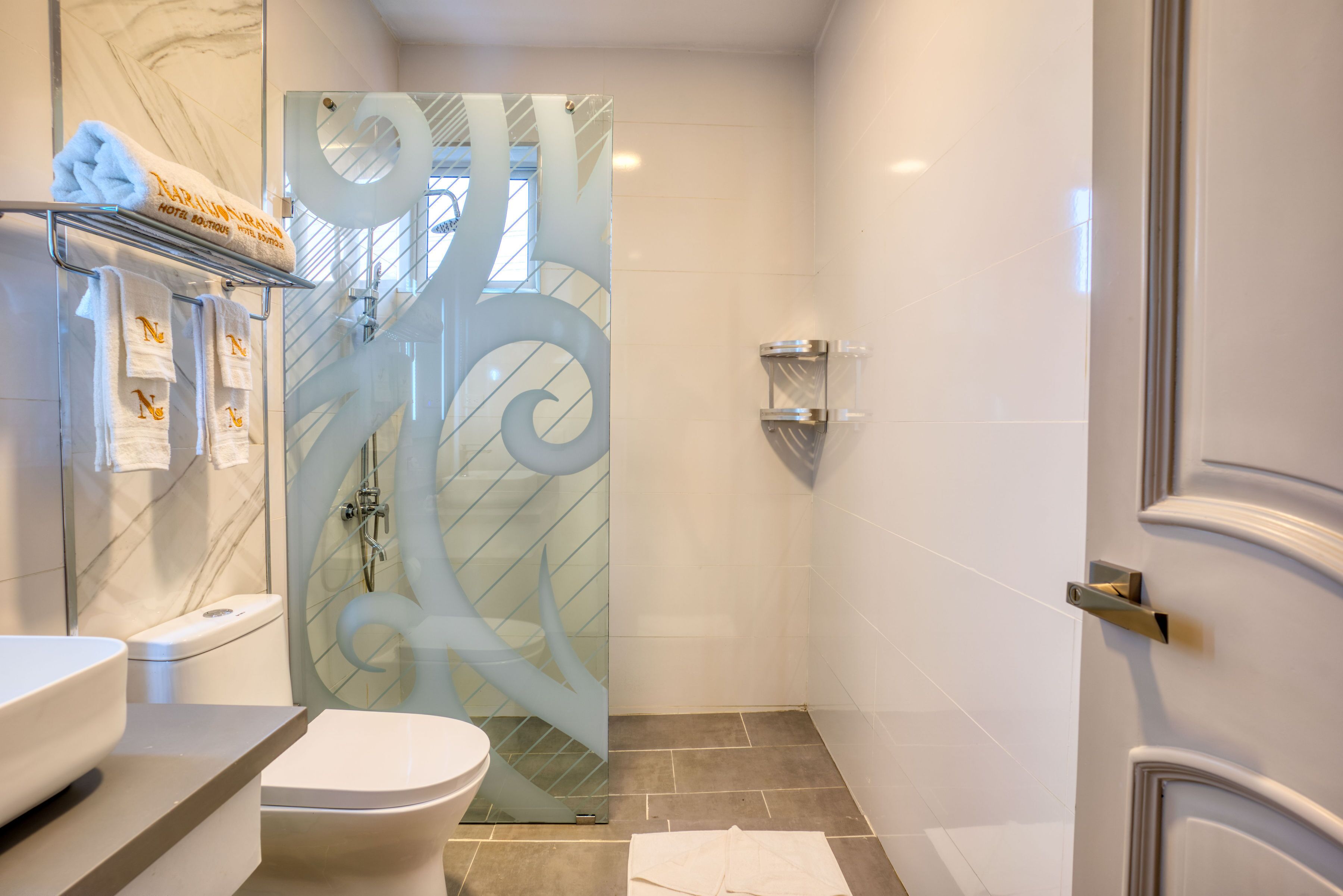 shower, rainfall showerhead, hair dryer, towels