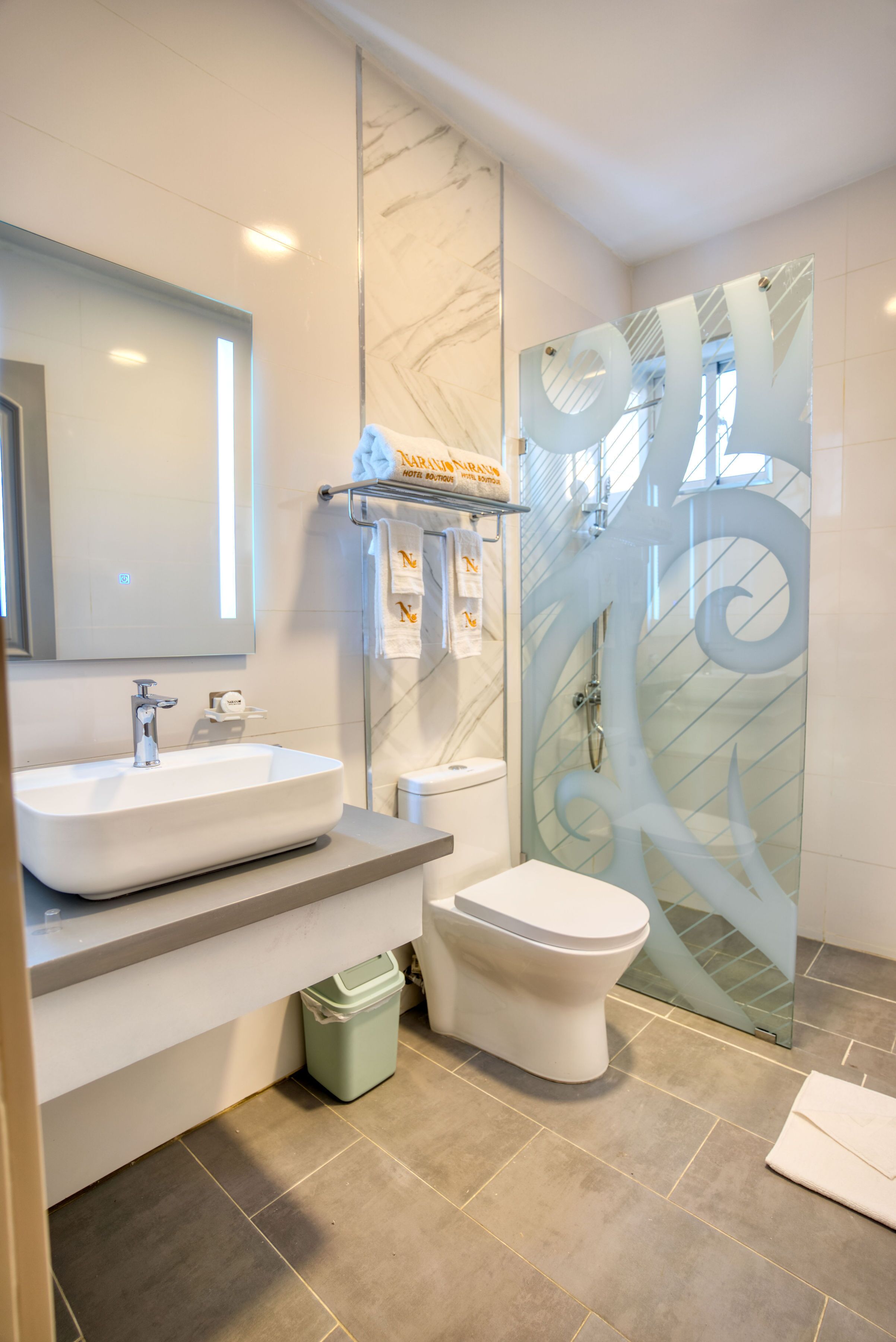 shower, rainfall showerhead, hair dryer, towels