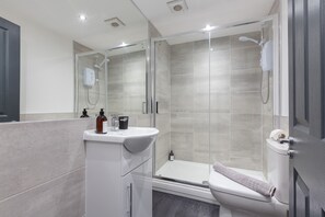Shower, hair dryer, towels, soap