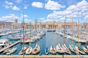 A marina filled with various boats docked at the pier.