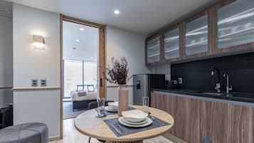 Standard Apartment with Balcony | Living area | 50-inch Smart TV with digital channels, TV