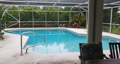 Jupiter house near beach sleeps 10 , heated enclosed pool .