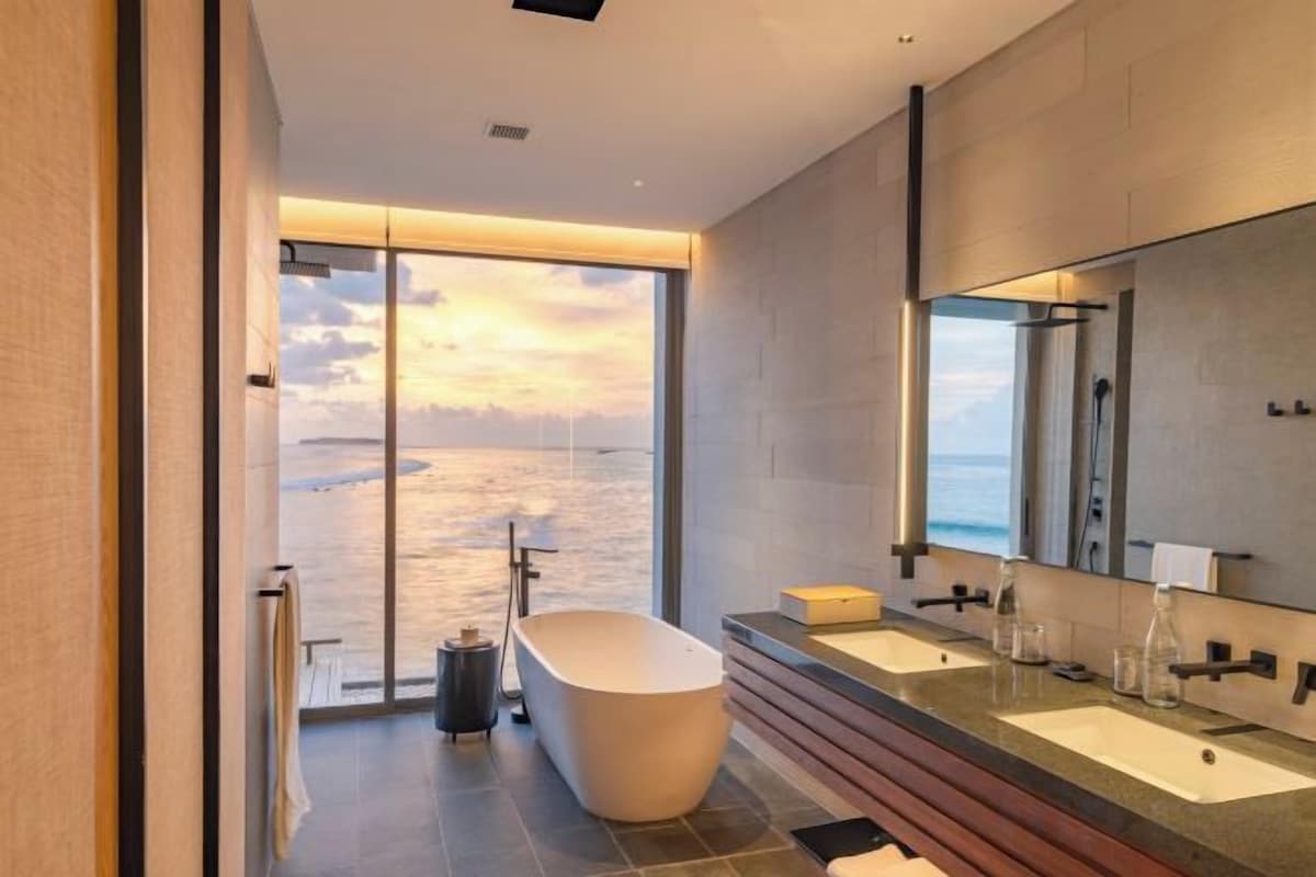 Separate tub and shower, rainfall showerhead, free toiletries
