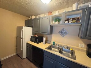 Fridge, microwave, stovetop, coffee/tea maker