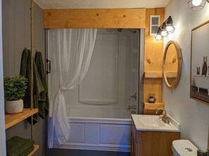 Combined shower/bathtub, hair dryer, towels, soap