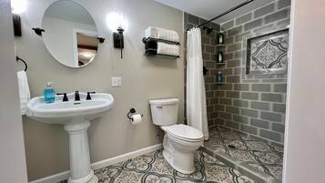 Bathtub, hair dryer, towels, soap