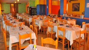 A large dining area with multiple tables and chairs, arranged in rows. - La Fenice (Jesolo)