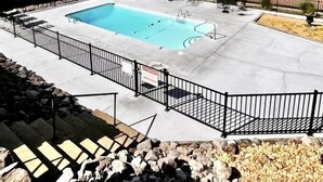 A swimming pool with a surrounding deck, a fence, and a staircase leading down. - Relax & Enjoy beautiful Sunsets!  * Boating Packages Available! (Hot Springs)