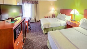 A hotel room with two beds, a TV, a desk, and a chair. - Quality Inn & Suites Downtown Mansfield (Mansfield)