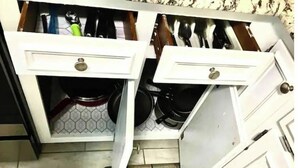 A kitchen with two open drawers, one containing pots and pans, and the other with utensils. - 3 Bed 2.5 Bath, Pet friendly with HotTub, walk to public beach (North Myrtle Beach)