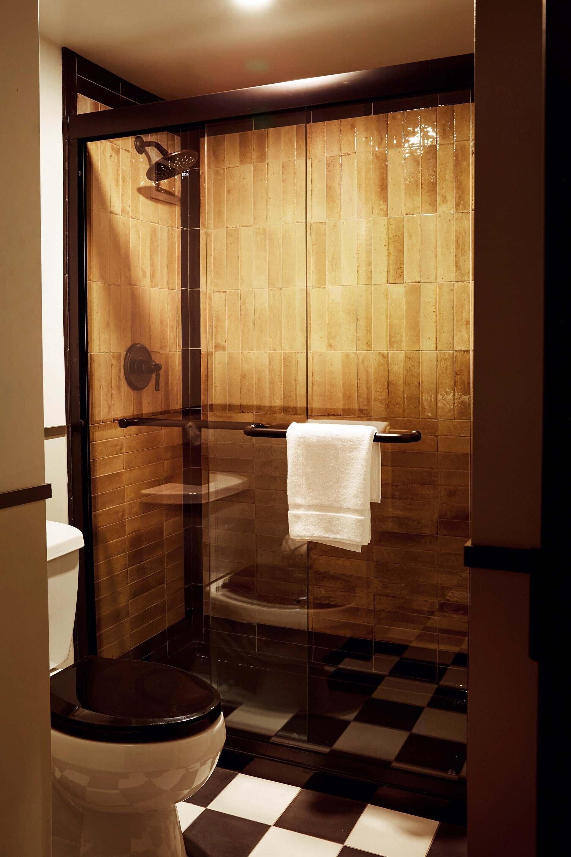 Shower, designer toiletries, hair dryer, bathrobes