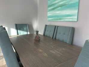 Enjoy meals in this stylish dining room with a large table and six comfortable chairs.