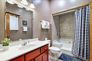 Combined shower/bathtub, jetted bath, hair dryer, towels - Cozy Cabin Retreat: Hot Tub & Close to Smoky Mountain Attractions (Sevierville)