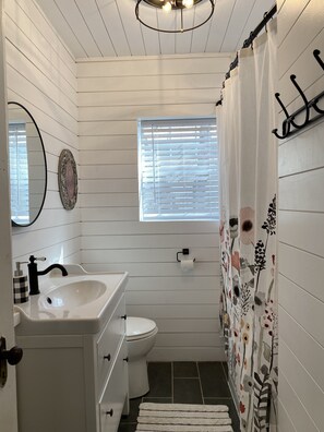 Combined shower/bathtub, hair dryer, towels, soap - Hollywood House sits in a quiet neighborhood. (Coleman)