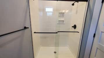 Combined shower/tub, hair dryer, towels, soap