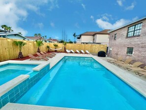A heated pool, pool loungers