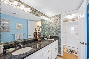Combined shower/tub, hair dryer, towels, soap