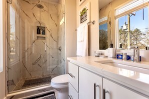 Combined shower/tub, hair dryer, towels, soap