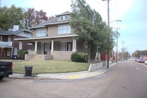 Situated on a quiet street, this charming home features a two-story facade with a front porch and covered entryway.