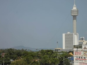 A view of a cityscape with a prominent tower and a building with a sign reading "BUNGY JUMP". - View Talay Vt2a F5 R207 (Pattaya)