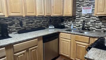 Microwave, dishwasher, coffee/tea maker, cookware/dishes/utensils