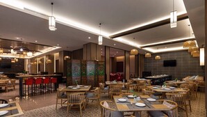 A restaurant with multiple dining areas, wooden furniture, and a patterned floor. - Ramada by Wyndham Daocheng (Garze)