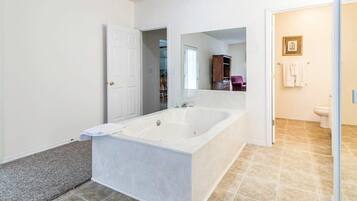 Bathtub, hair dryer, towels