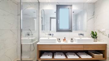Shower, eco-friendly toiletries, hair dryer, towels