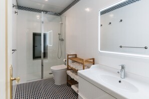 Shower, hair dryer, towels, soap