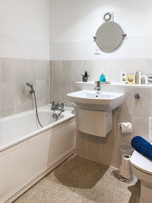 Combined shower/bathtub, hair dryer, towels, soap