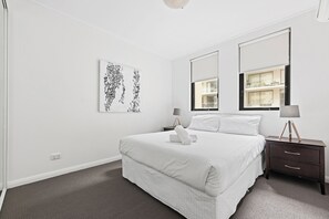 2 bedrooms, premium bedding, laptop workspace, iron/ironing board