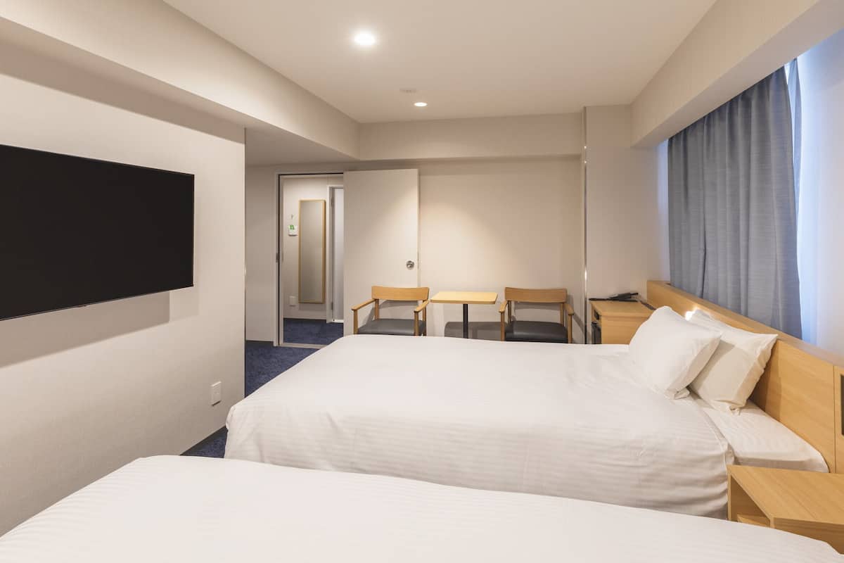 quadruple room, non smoking | 1 bedroom, down duvets, desk, blackout curtains